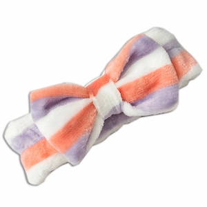 Soft coral fleece headband with white orange and purple stripes and large bow decoration