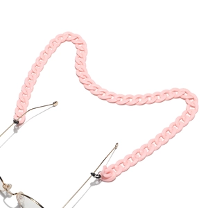 Detailed view of pink acrylic glasses chain with textured matte links and rubber connectors