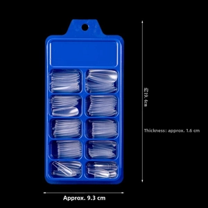 Detailed view of clear coffin press on nails in a blue 10-slot storage box