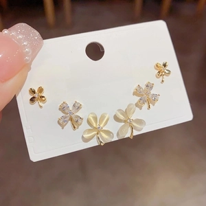 5-piece gold clover stud earrings set with cat eye stones and sparkling zircons