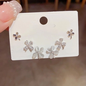 Elegant S925 silver cat-eye flower stud earring set with zircon clover accents