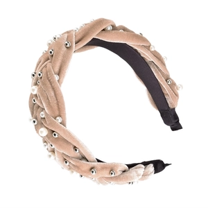 Detail of khaki velvet braided headband with white pearls and silver beads on white background