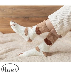 Detail of coral fleece cat claw socks with thick texture and warm plush material