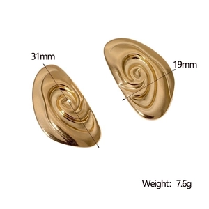 Detail view of gold spiral earrings showing dimensions 31mm length and 19mm width