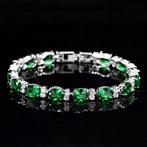 Elegant emerald green oval bracelet with AAA zircon accents on polished silver chain