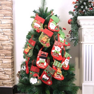 Detail of Christmas stockings with 3D Santa and Reindeer hanging on a tree