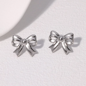 Minimalist silver bow knot earrings in polished stainless steel for women