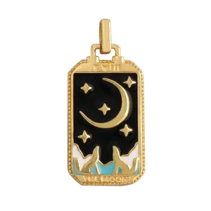 Detail of gold Tarot Moon pendant with enamel finish and copper zircon inlay