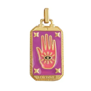Detail of gold-plated Tarot pendant with purple enamel and Fortune engraving