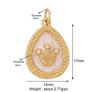 Detailed view of crown-embossed heart pendant with dimensions 17mm by 14mm