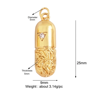 Macro view of capsule pendant with triangle gemstone and textured gold metal finish