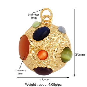 Close-up of golden mushroom charm pendant with colorful gems and hammered texture