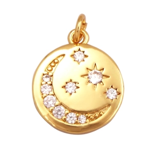 Macro shot of celestial sun moon star gold pendant charm with cubic zirconia inlay details
