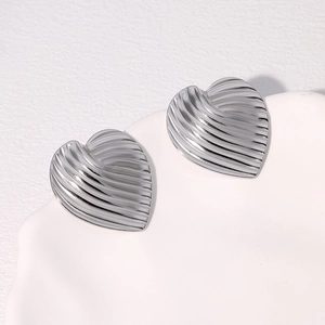 Minimalist silver stainless steel heart stud earrings with a striped metallic texture
