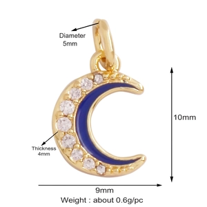 Macro view of gold moon charm with blue enamel and white zircon details and measurements