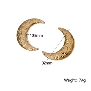 Detail view of gold crescent moon earrings with textured finish and size dimensions