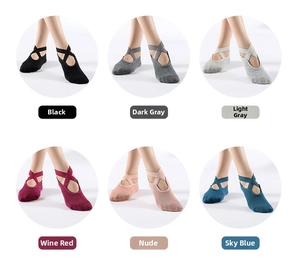 Detail view of anti-slip yoga socks with cross straps in six various colors