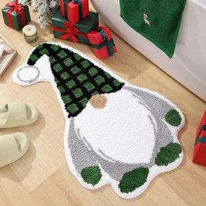 Detail of Christmas gnome bath mat with green plaid hat on rustic wooden floor background