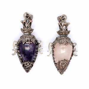 Vintage copper pendant necklace featuring hollowed crystal vials in purple and pink