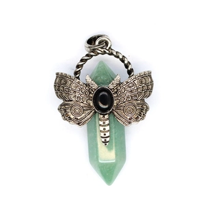 Detail of vintage silver dragonfly pendant with green hexagonal fluorite crystal stone