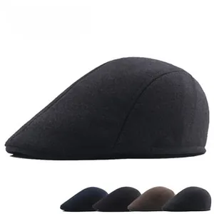 Detail showing various colors of thick wool plaid flat caps with warm cotton lining