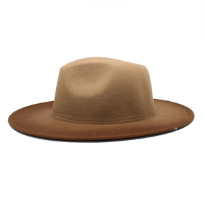 Close-up of dual-tone fedora hat showing textured wool felt and detailed brim stitching