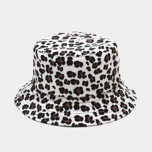 Close-up of leopard print bucket hat with soft plush faux fur texture for winter