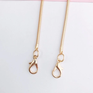 Detailed macro view of a 110cm golden metal snake chain strap with secure lobster clasps