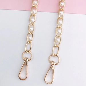 Golden metal chain shoulder strap with white faux pearls and secure lobster clasps
