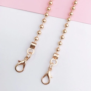 Close-up of a 110cm gold metal ball chain strap featuring lobster clasps on both ends
