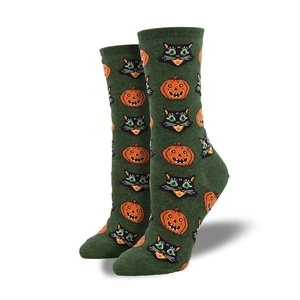 Detail of Halloween socks featuring orange jack-o-lanterns and black cats on dark green