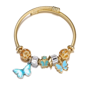 Gold stainless steel cable bracelet featuring blue gradient butterfly charms and gold beads