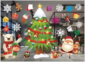 Close-up of colorful Christmas window stickers with Santa, reindeer, and snowflakes