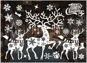 White snowflake and reindeer window decals displayed on a glass storefront background