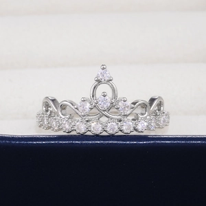 Macro shot of silver tiara ring with micro-pave cubic zirconia on a jewelry box