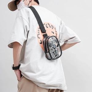 Candy-colored transparent PVC crossbody bag with adjustable black strap and jelly finish