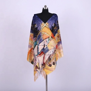 Detail of soft winter shawl featuring circus horse print and elegant fringe tassels