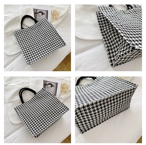 Detailed four-way view showing black and white houndstooth canvas tote bag texture