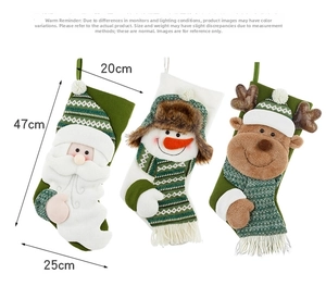 Detailed view of large knitted Christmas stockings with 3D Santa and Reindeer appliques