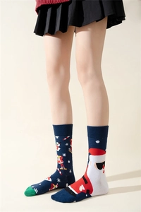 Detailed view of mid-calf Christmas socks featuring Santa Claus and snowman patterns