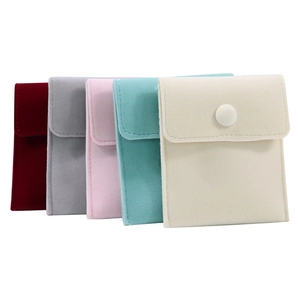Soft velvet jewelry pouches with snap button closure in multiple elegant colors