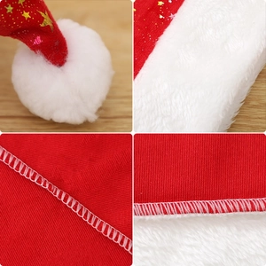 Red velvet Christmas hat with gold star patterns and white plush trim for holiday parties