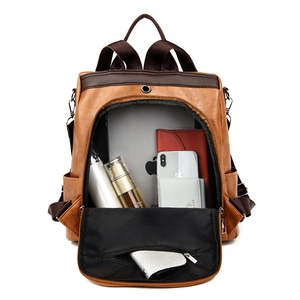 Brown PU leather backpack with large capacity main compartment shown on white background