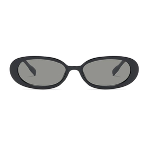 Retro oval black sunglasses with smoke grey lenses for a minimalist street style look