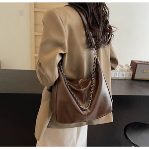 Brown PU leather hobo bag featuring metal chain strap and white contrast stitching