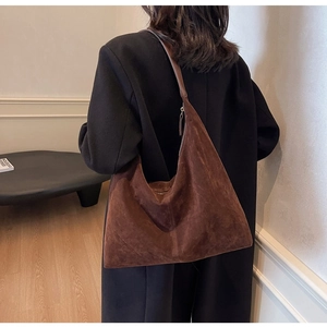 Brown faux suede hobo bag shown on shoulder, minimalist large tote for stylish autumn wear