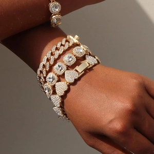 Golden hip hop chain bracelet set featuring square and heart diamonds on model wrist