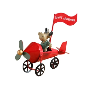 Red iron Christmas airplane ornament with reindeer pilot and Merry Christmas flag