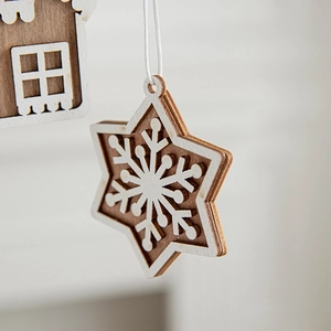 Nordic wooden hexagon star ornament with carved snowflake and white paint finish