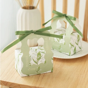 Elegant green lily of the valley wedding candy gift box with silk ribbon handle